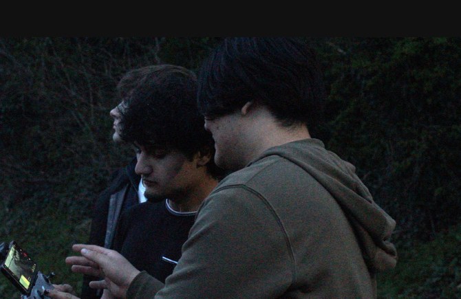 Members testing hardware during a late workshop session